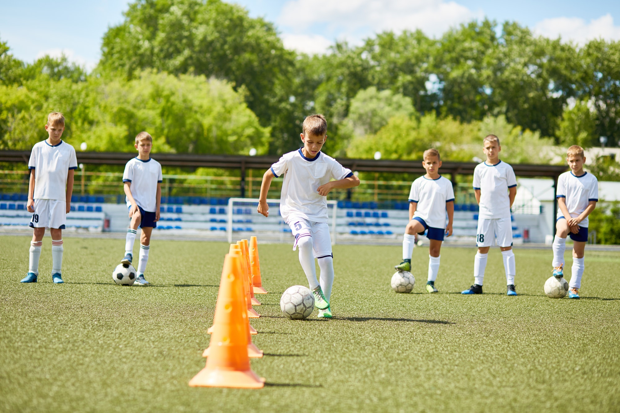 Team of Boys Training for Football Game